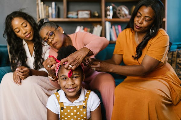 Three generations of a family share a tender morning together